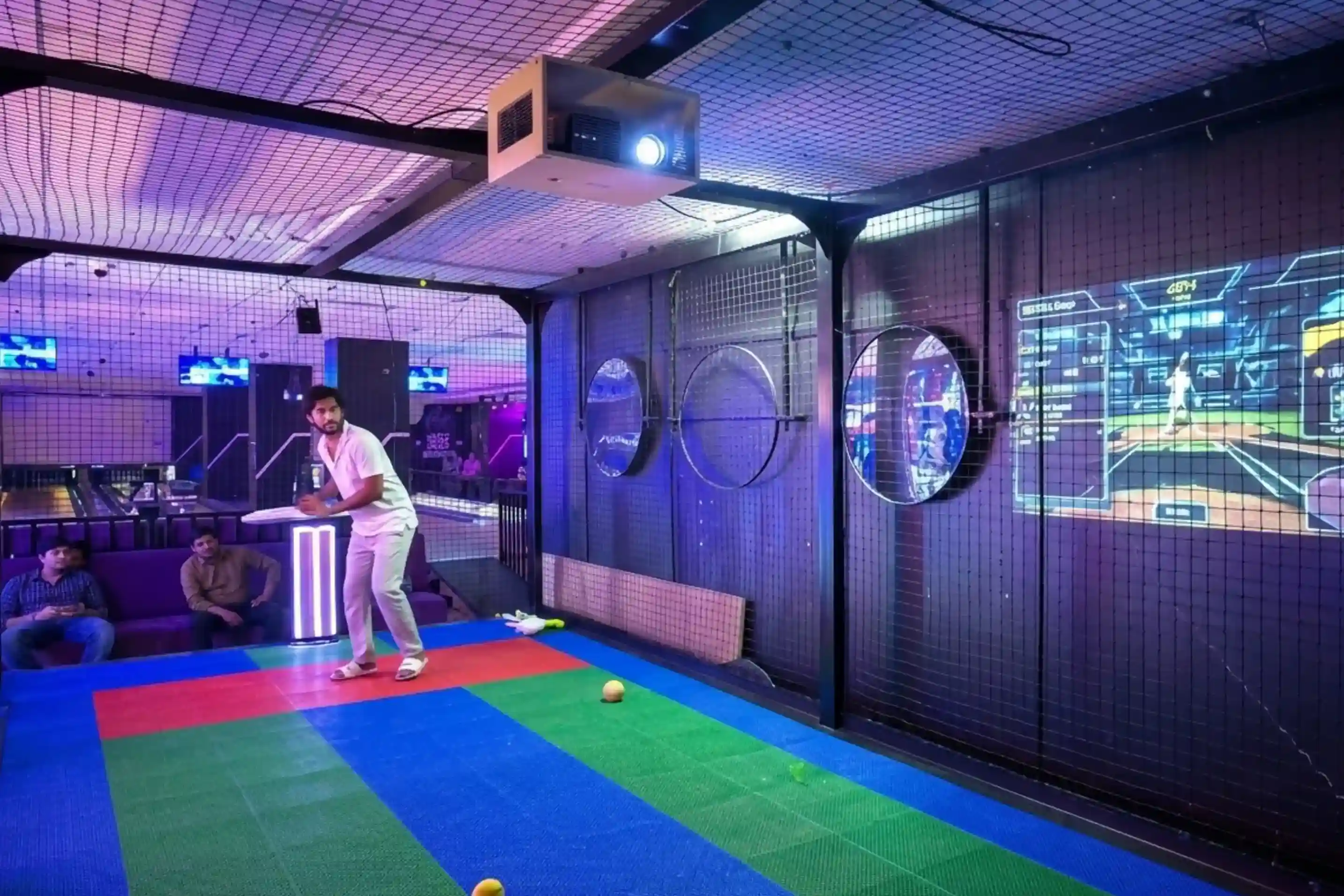 Come Let's Play branding projection on cricket simulator screen at Game Xtreme