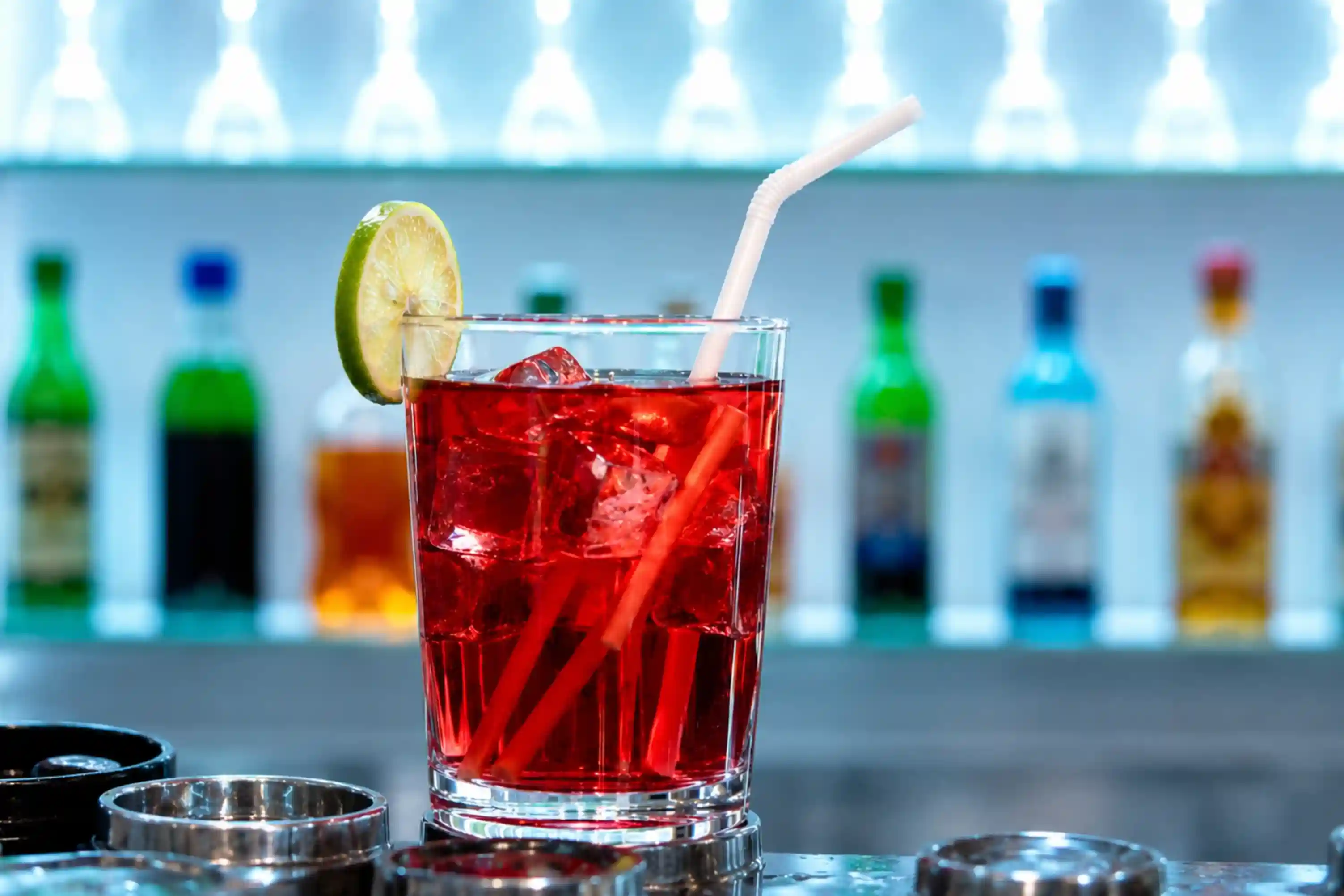 Lady in Red mocktail — vibrant red drink with lime garnish
